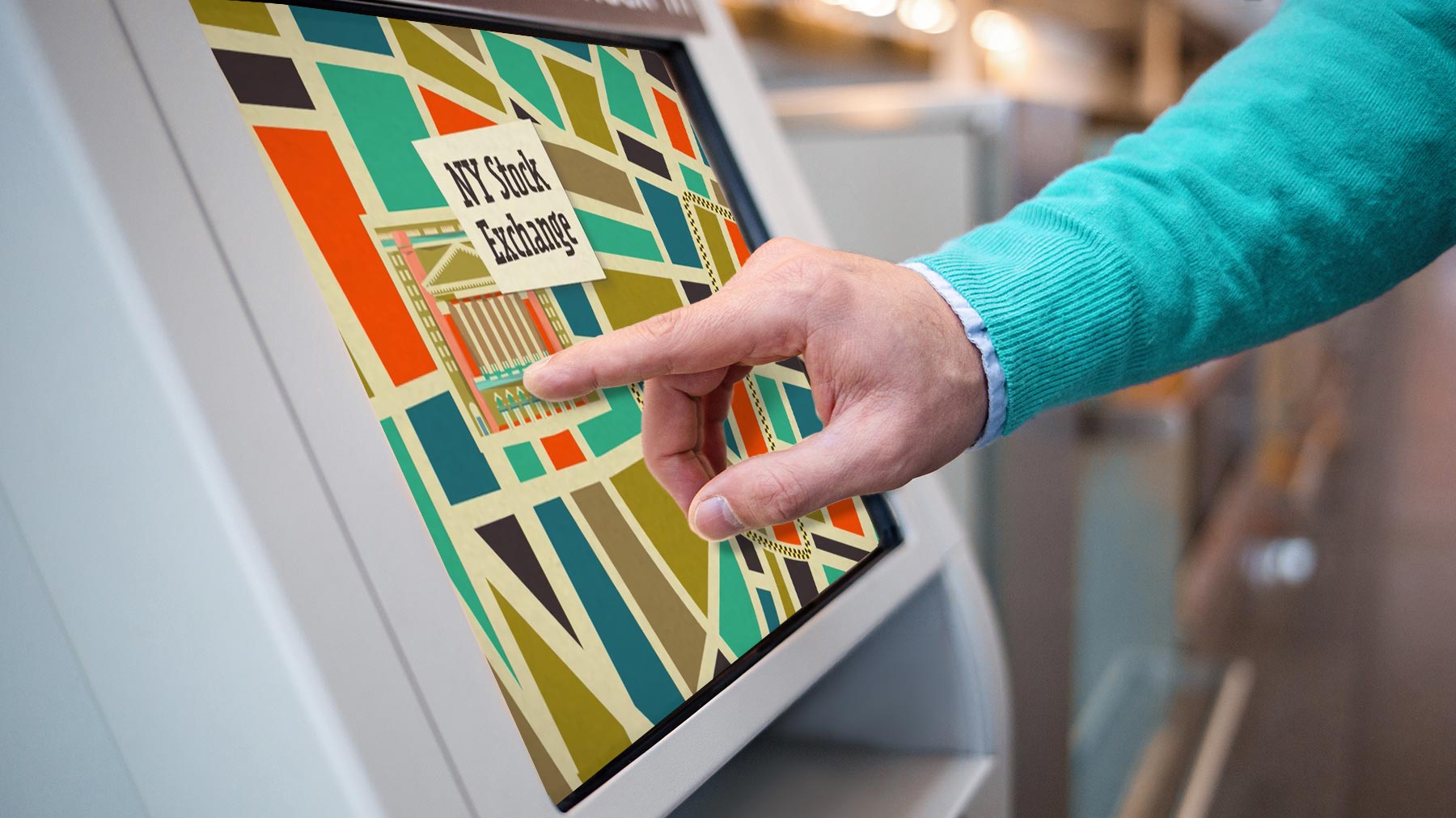 Man touches a computer screen featuring a map around the New York Stock Exchange.