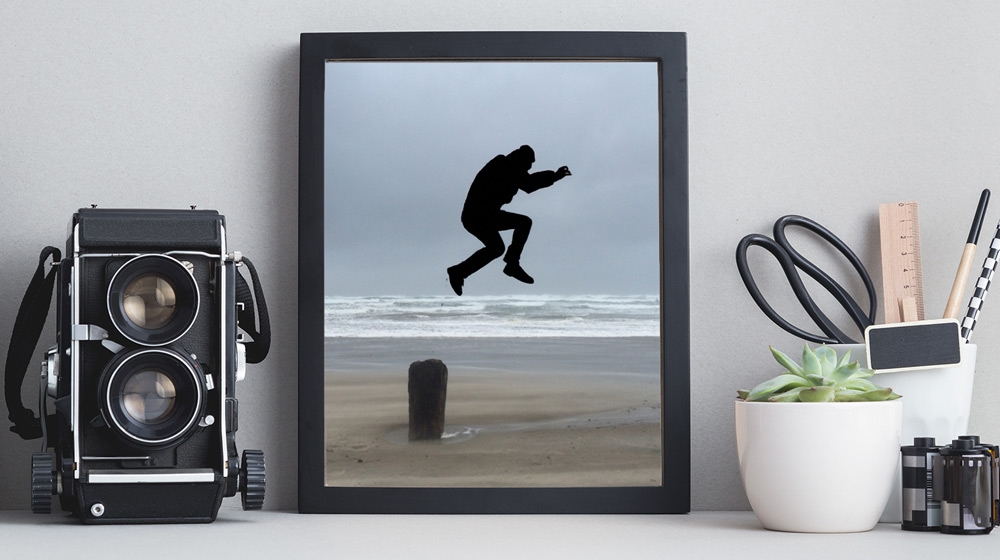 Silhouette of a man jumping over a post on the beach. Silhouette of a man jumping over a post on the beach.
