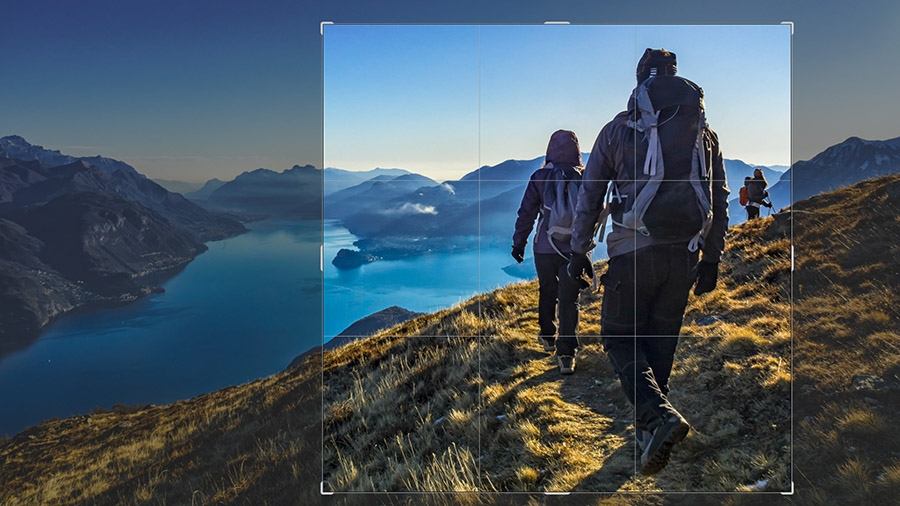 Photo of hikers on a trail overlooking a river with a section of the image highlighted with crop borders Photo of hikers on a trail overlooking a river with a section of the image highlighted with crop borders