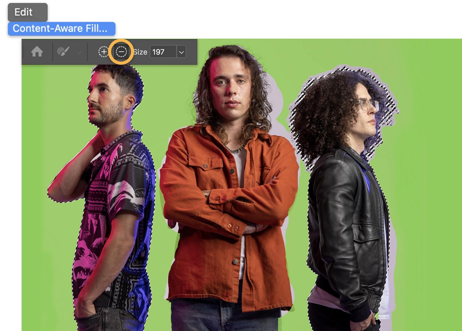 The same photo with the Content-Aware Fill highlighting areas to be sampled from in green. The Sampling Brush has subtracted the lead singer’s jacket from the area to be sampled.