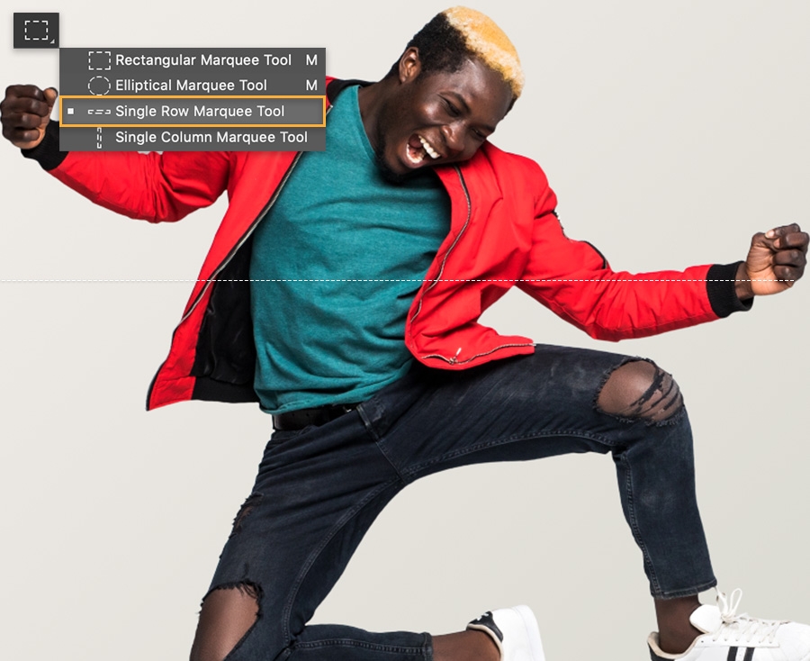 Adobe Photoshop toolbar with single row marquee tool selected, canvas shows man jumping in the air Adobe Photoshop toolbar with single row marquee tool selected, canvas shows man jumping in the air