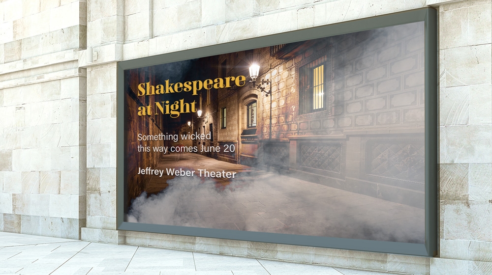Side of white marble building showcasing Shakespeare at Night poster of lit nighttime alley with smoke effects on right side Side of white marble building showcasing Shakespeare at Night poster of lit nighttime alley with smoke effects on right side