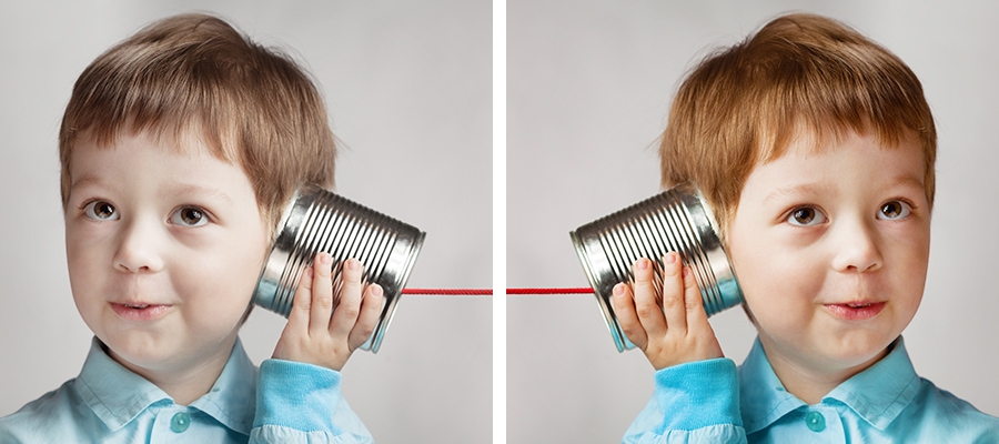 Side by side photos of a boy with a toy can phone, the right side image has been warmed up by removing a bluish tint Side by side photos of a boy with a toy can phone, the right side image has been warmed up by removing a bluish tint